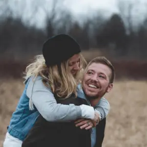 Couple smiling after the man had a non-surgical penis enlargement procedure